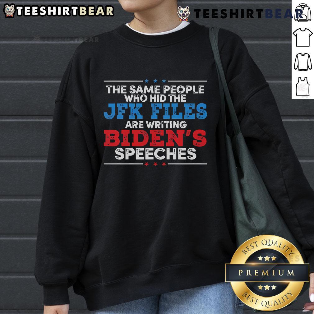 Hot sweatshirt featuring the phrase 'The same people who hid the JFK files are writing Biden's speeches' in bold text.
