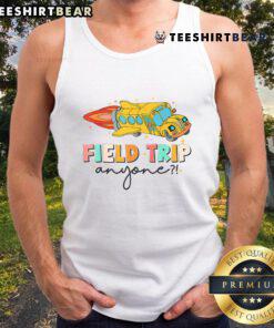 Teachers in fun tank tops at a field day, enjoying a nice field trip together with students outdoors.