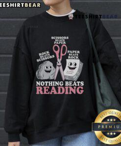 Cozy 'Nothing Beats Reading Rock Paper Scissors' sweatshirt, perfect for book lovers and gamers, showcasing fun design.