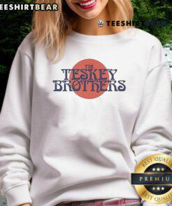Alt Text: Nice The Teskey Brothers Circle Logo Sweatshirt featuring a stylish design and comfortable fit for fans.