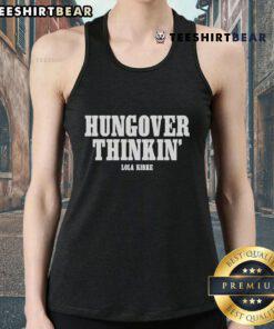 Alt Text: Lola Kirke wearing a stylish 'Hungover Thinkin' tank top, showcasing her unique fashion sense and casual style.