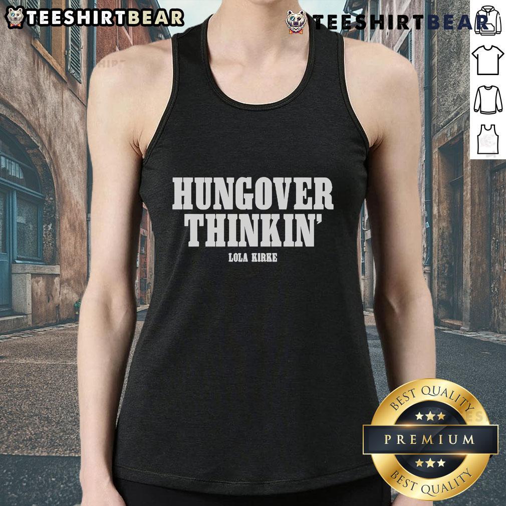 Alt Text: Lola Kirke wearing a stylish 'Hungover Thinkin' tank top, showcasing her unique fashion sense and casual style.