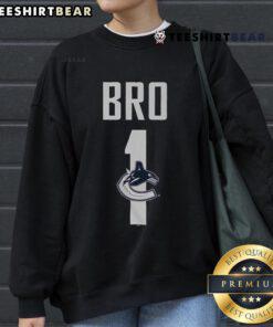 Alt Text: Official Vancouver Canucks Number 1 Bro Sweatshirt featuring team colors and logo, perfect for fans and casual wear.