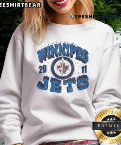 Official Winnipeg Jets Rink Arched Wordmark Sweatshirt featuring team colors and logo for fans and collectors.