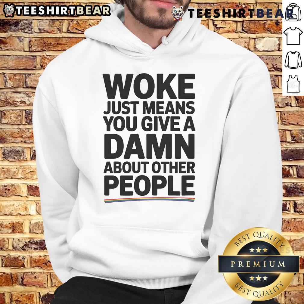 Official Woke Pride Hoodie featuring the slogan 'Just Means You Give a Damn About Other People' in vibrant colors.