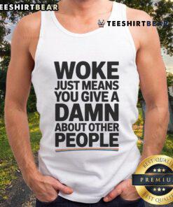 Pride tank top featuring 'Woke Just Means You Give a Damn About Other People' slogan in vibrant colors.