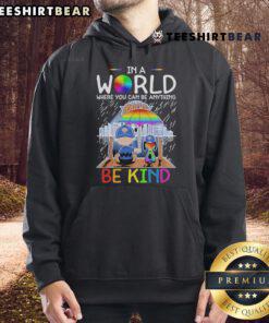 Alt Text: Pretty Charlie Brown and Snoopy in New York Knicks hoodie with 'Be Kind' slogan, promoting kindness and positivity.