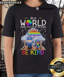 Pretty Charlie Brown and Snoopy in New York Knicks tee: 'In a world where you can be anything, be kind' design.