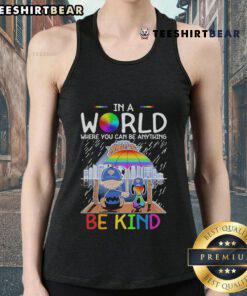 Pretty Charlie Brown and Snoopy New York Knicks tank top, featuring 'In a world where you can be anything, be kind' slogan.