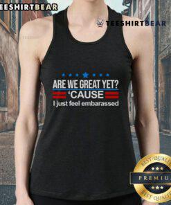 Model wearing 'Are We Great Yet' striped tank top, showcasing casual summer style and trendy fashion vibes.