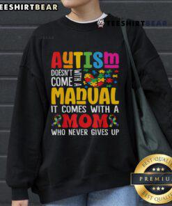 Mom wearing a comfy sweatshirt that reads 'Top Autism Mom Life Doesn't Come With a Manual' for Autism Awareness.