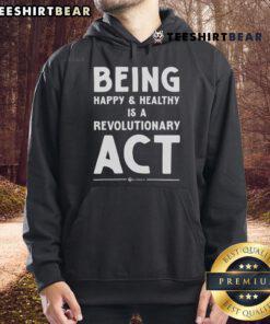 Person wearing 'Top Being Happy and Healthy is a Revolutionary Act' hoodie, showcasing a positive lifestyle and self-care.