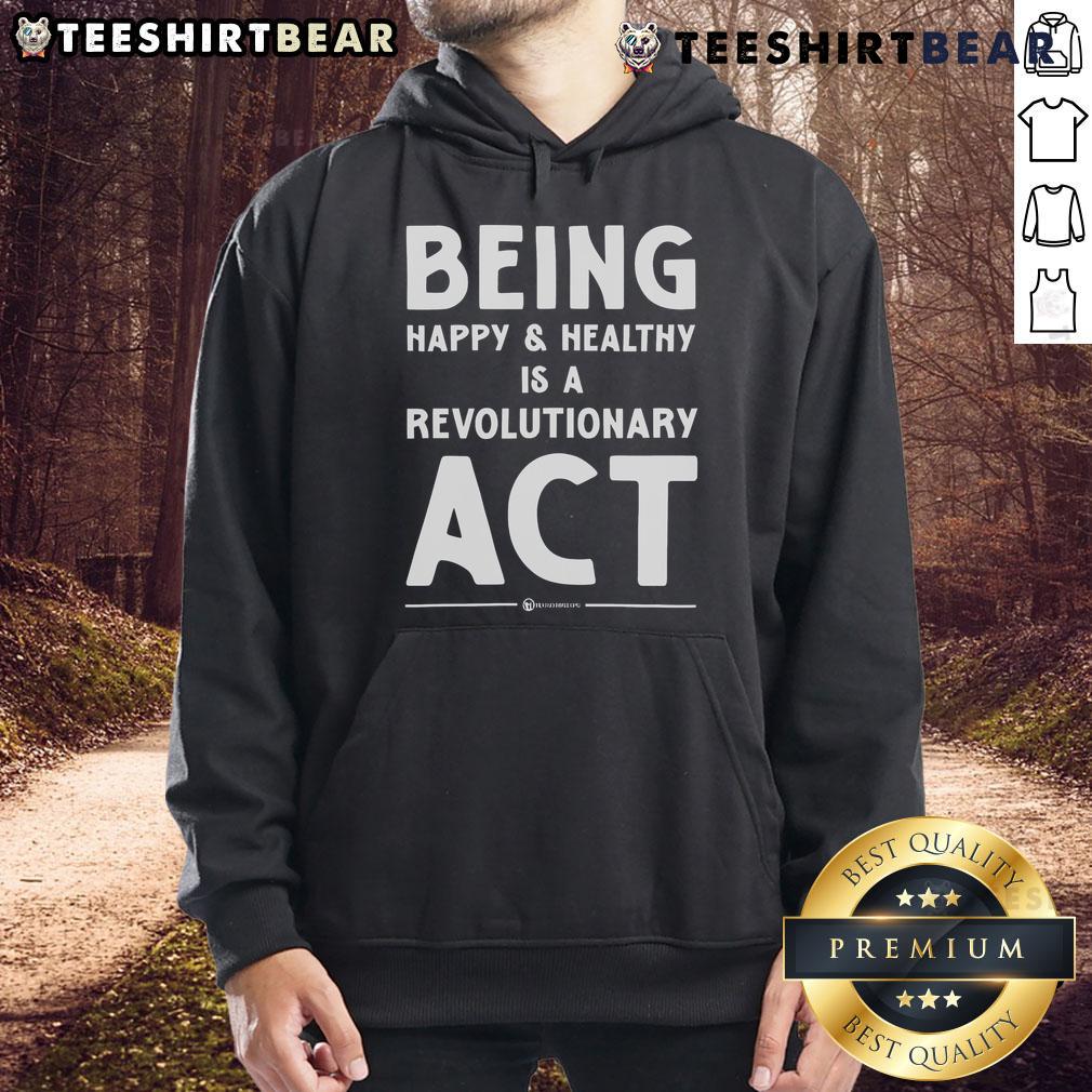 Person wearing 'Top Being Happy and Healthy is a Revolutionary Act' hoodie, showcasing a positive lifestyle and self-care.