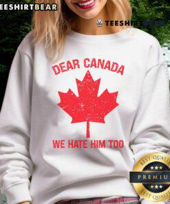 Cozy Canada sweatshirt with maple leaf design and 'We Hate Him Too' slogan, perfect for expressing Canadian pride.