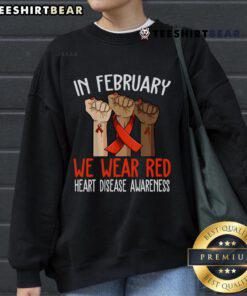 Top in February: We Wear Red Heart Disease Awareness Sweatshirt showcasing a vibrant red design for awareness.