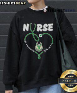 Cozy 'Top Nurse Milwaukee Bucks It's A Work Of Heart Sweatshirt' featuring team colors and heartwarming design.