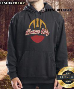 Top silhouette of Kansas City football fan in hoodie, showcasing team spirit and pride for KC football culture.