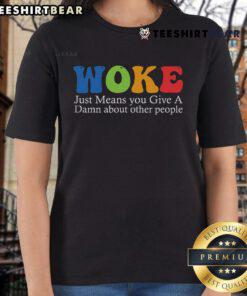 Top Woke Ladies Tee featuring 'Just Means You Give A Damn About Other People' graphic, perfect for socially conscious fashion.