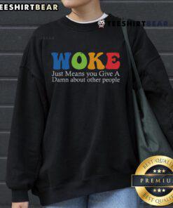 Alt Text: Cozy sweatshirt featuring 'Top Woke Just Means You Give A Damn About Other People' graphic design, perfect for casual wear.
