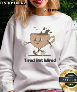 Cute tired but wired coffee cup sweatshirt featuring a cozy design perfect for coffee lovers and casual wear.