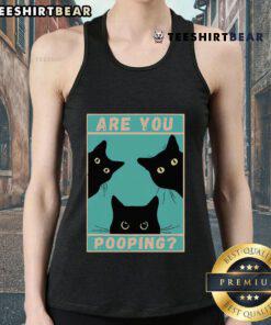 Funny cat in a tank top with the phrase Are You Pooping? capturing a humorous moment for pet lovers and cat enthusiasts.