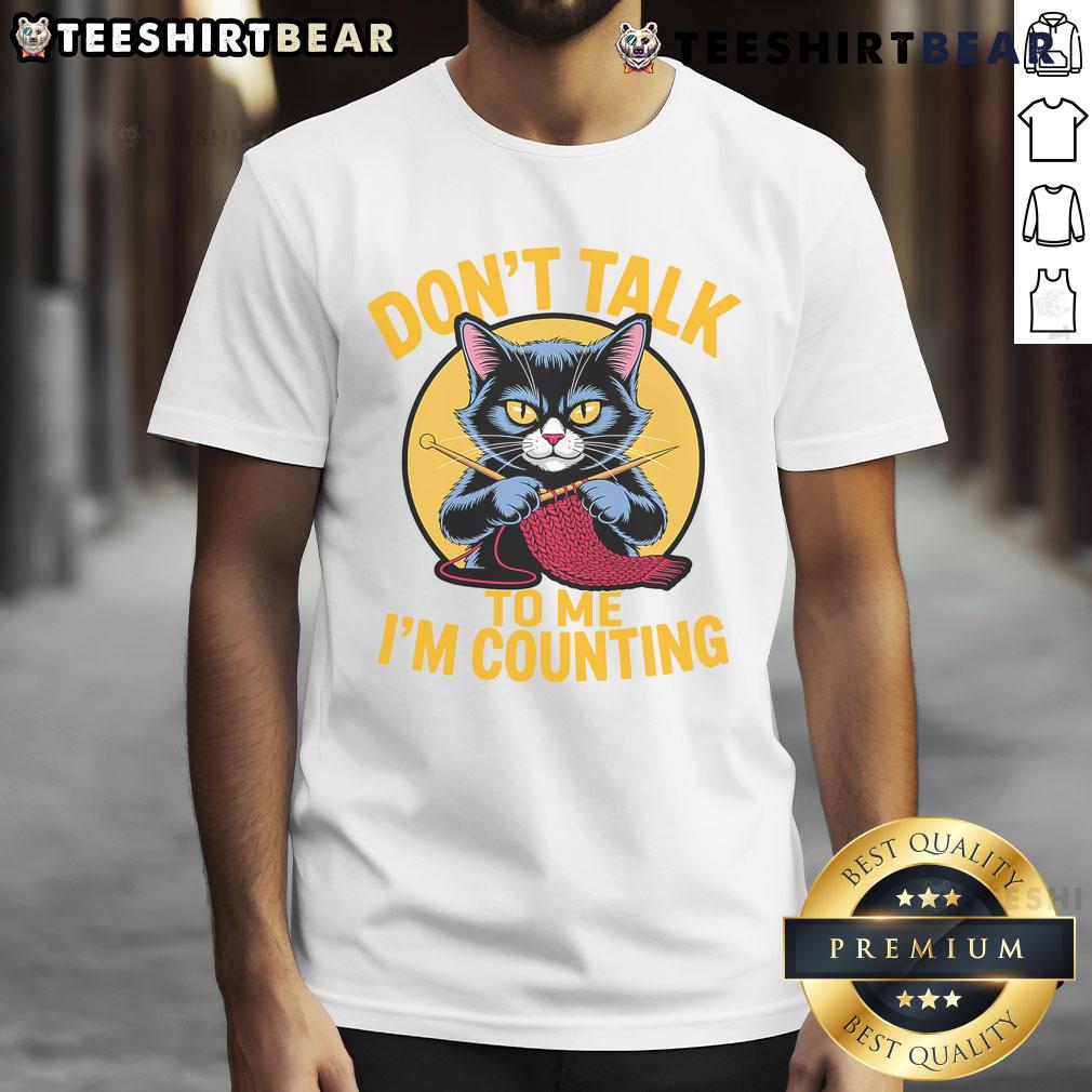 Funny cat knitting design on a T-shirt with 'Don't talk to me, I'm counting' text for knitting lovers.