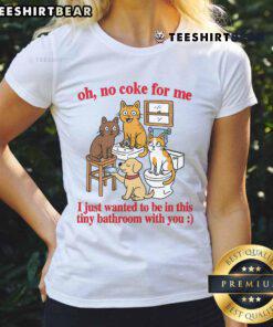 Funny cats in a tiny bathroom, playfully ignoring Coke, wearing humorous expressions on a ladies' tee shirt.