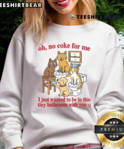 Alt Text: Funny cats in a tiny bathroom wearing a sweatshirt that says 'Oh No Coke for Me' showcasing adorable feline antics.