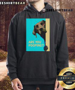 Funny dog wearing a hoodie with 'Are You Pooping?' text, showcasing a humorous pet fashion statement.