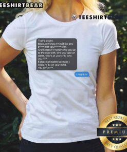 Alt Text: Funny Elijah texting on his phone, wearing a humorous The Boy I Might Be ladies tee, showcasing playful style.
