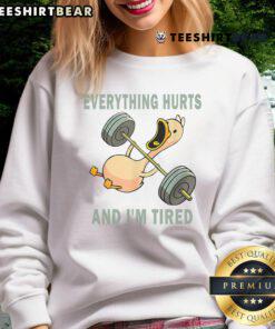 Funny gym duck quote on a sweatshirt: Everything Hurts And I'm Tired perfect for workout enthusiasts and humor lovers.