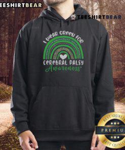 Person wearing a green hoodie for Cerebral Palsy Awareness under a vibrant rainbow in March.