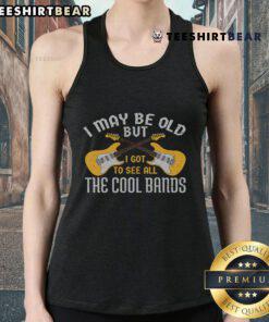 Alt Text: Happy woman in a guitar tank top celebrating her love for music and cool bands, showcasing a vintage style.