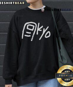 Happy Paolo wearing a Tokyo Toe Kyo sweatshirt, showcasing vibrant design and stylish urban fashion.