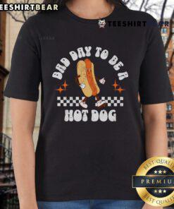 4th of July ladies tee featuring a fun checkered design and 'Bad Day to Be a Hot Dog' graphic for festive celebrations.