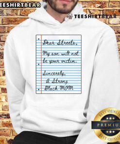 Strong Black mom wearing 'Nice Dear Streets, My Son Will Not Be Your Victim' hoodie, promoting empowerment and safety.