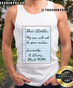 Strong Black mom wearing a tank top with 'Nice Dear Streets, My Son Will Not Be Your Victim' message, showcasing empowerment.