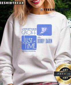 Alt Text: Jonathan Groff in a Bobby Darin musical sweatshirt, showcasing his stylish look for the production Just In Time.