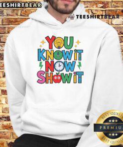 Alt Text: Teacher wearing a motivational hoodie that says 'Nice You Know It Now Show It' on Testing Day.