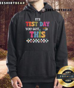 Student wearing a 'Test Day, You Got This' hoodie, smiling confidently, ready for exam motivation from their teacher.