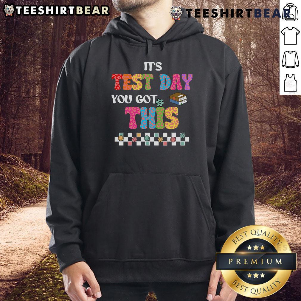 Student wearing a 'Test Day, You Got This' hoodie, smiling confidently, ready for exam motivation from their teacher.