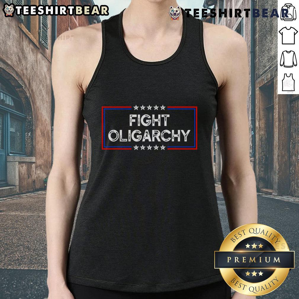 Activist wearing a 'Top Fight Oligarchy' tank top, standing against corporate greed at a protest rally.