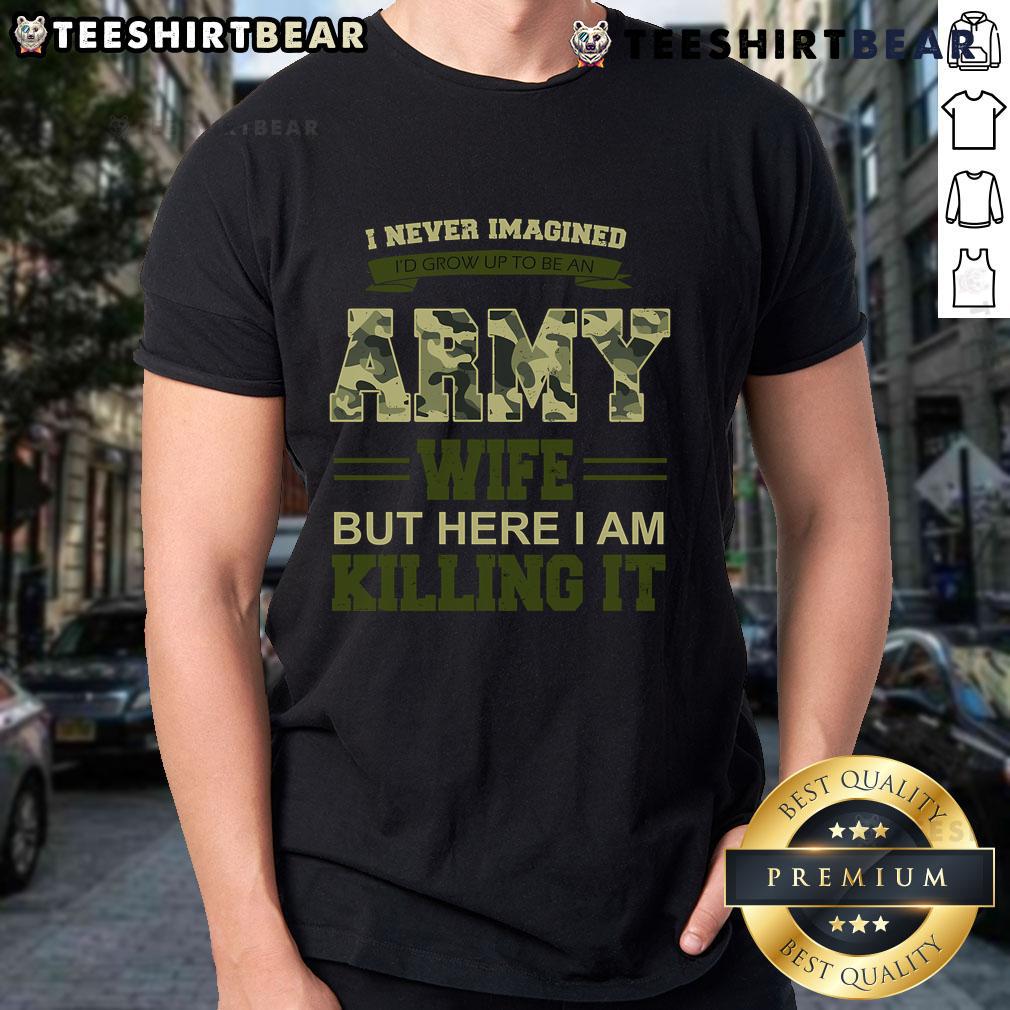 Alt Text: Woman wearing 'I Never Imagined I'd Grow Up To Be An Army Wife But Here I Am Killing It' T-shirt, showcasing army wife pride.