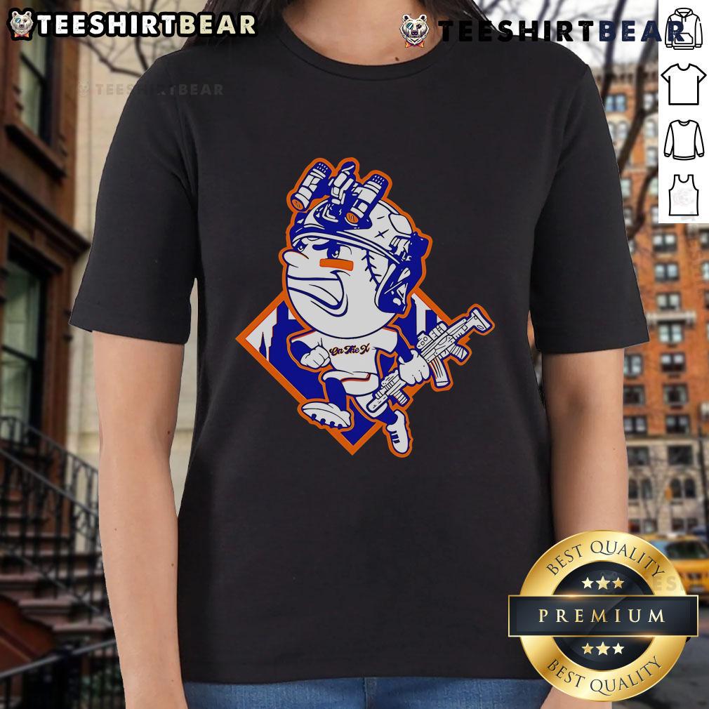 Alt Text: Top New York Mets Mr. Met mascot in a soldier's helmet on a stylish ladies tee, perfect for fans.