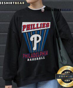 Alt Text: Top Philadelphia Phillies baseball starter sweatshirt featuring team logo and vibrant colors, perfect for fans.