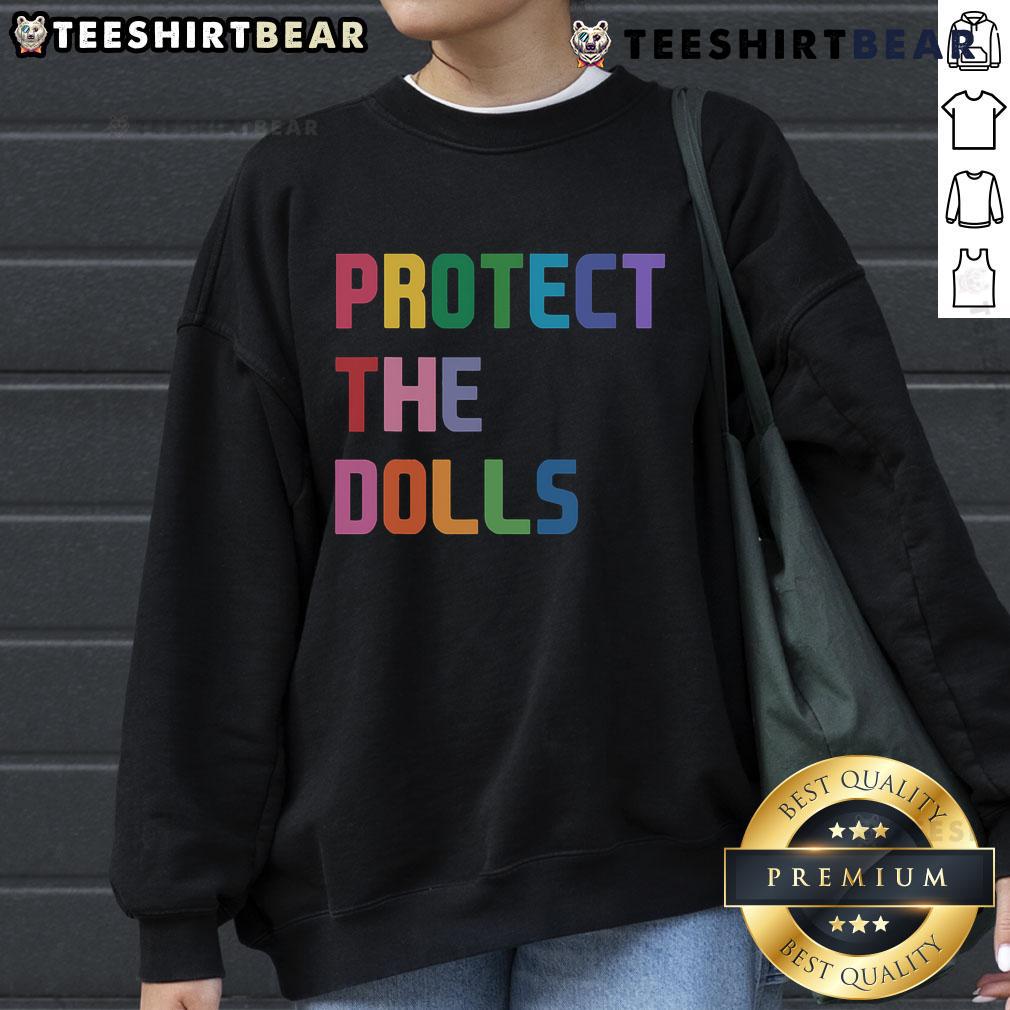 Cozy Top Protect The Dolls sweatshirt featuring vibrant graphics, perfect for fans of trendy streetwear and doll culture.