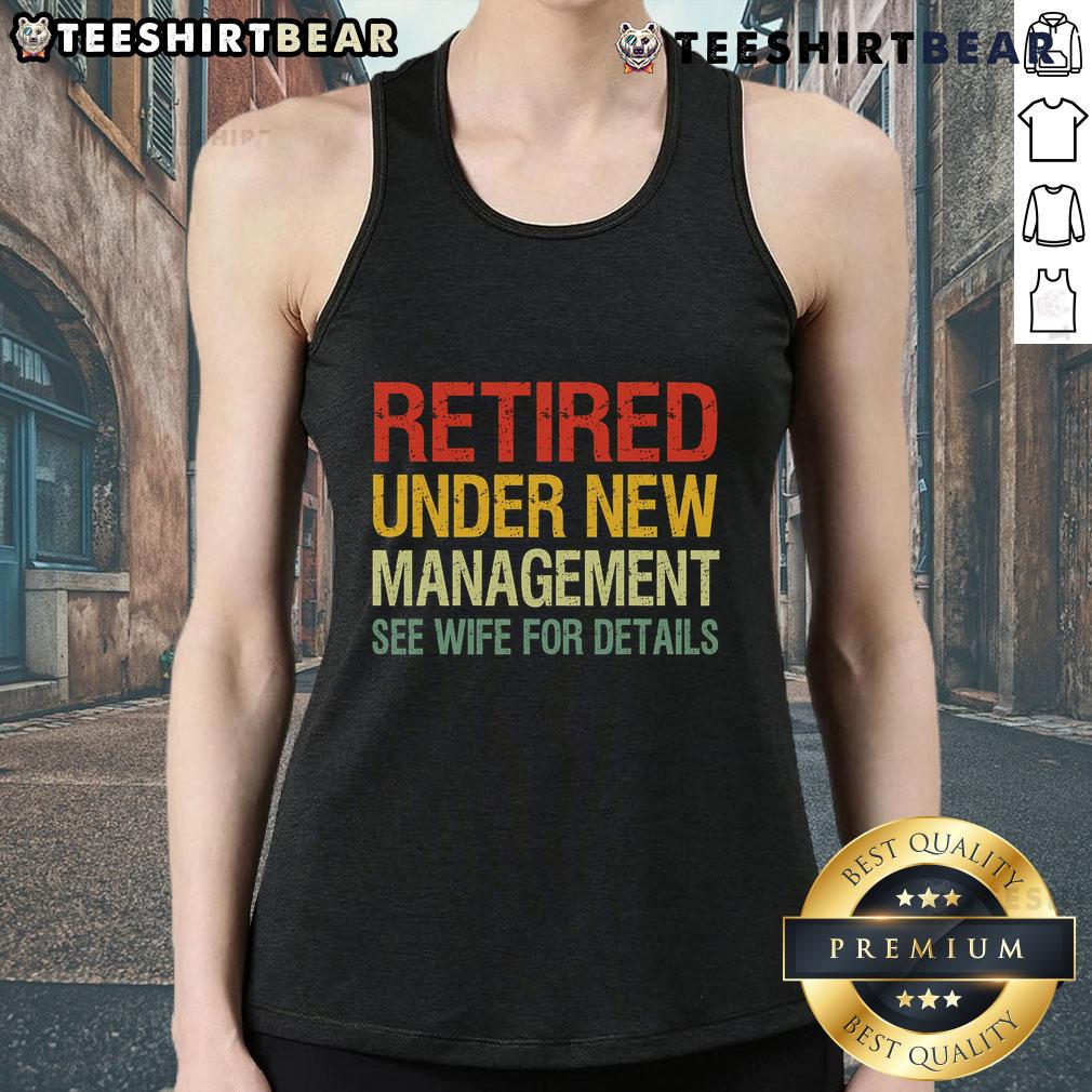 Woman wearing a 'Top Retired Under New Management' tank top, showcasing a fun and humorous retirement message.