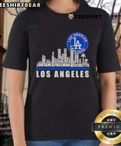 Los Angeles Dodgers players' names and logo on a stylish ladies tee with a top skyline city background.