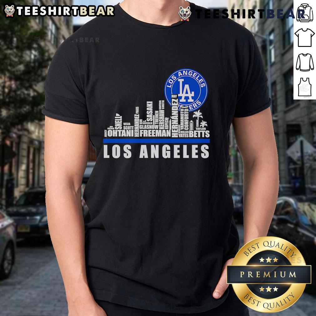 Alt Text: Los Angeles Dodgers T-Shirt featuring skyline design and player names, perfect for baseball fans and team supporters.