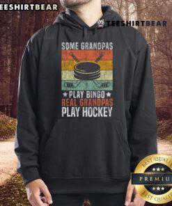Grandpa wearing 'Real Grandpas Play Hockey' hoodie, enjoying a game on ice, showcasing love for hockey over bingo.